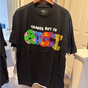 Black Graphic Tee with Colorful 'Thanks But I'm Gucci ' Design